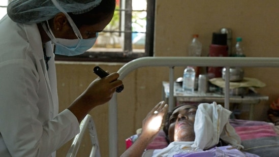 A doctor examines a patient who recovered from Covid-19 coronavirus and now infected with Black Fungus, a deadly fungal infection at a ward of a government hospital in Hyderabad.(AFP)