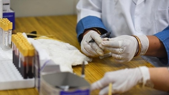 Medical staff work with samples taken during a serological survey for Covid-19 prevalence detection in New Delhi in October 2020. (HT Archive) Medical staff work with samples taken during a serological survey for Covid-19 prevalence detection in New Delhi in October 2020. (HT Archive)