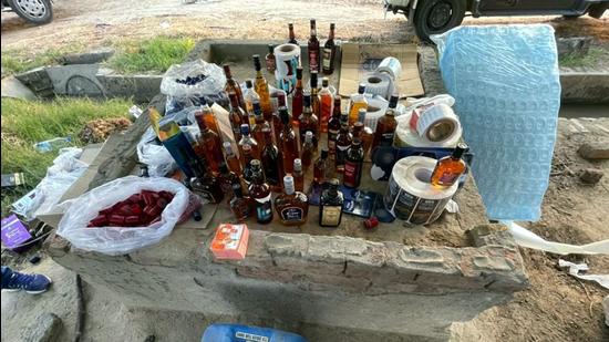 Besides recovering more than 2,200 liters of extra neutral alcohol, the excise team found a huge cache of holograms, packaging material of various premium liquor brands and packed cases ready for delivery. (HT Photo) Besides recovering more than 2,200 liters of extra neutral alcohol, the excise team found a huge cache of holograms, packaging material of various premium liquor brands and packed cases ready for delivery. (HT Photo)