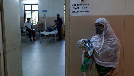A woman stands outside as a patient infected with black fungus is treated at the Mucormycosis ward of a government hospital in Hyderabad. (AP Photo)