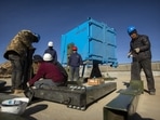 In this representative photo, construction workers prepare to install one of 18 wide-field air telescopes at an observatory at Haizi Mountain near Daocheng in southwestern China's Sichuan Province. (AP Photo) In this representative photo, construction workers prepare to install one of 18 wide-field air telescopes at an observatory at Haizi Mountain near Daocheng in southwestern China's Sichuan Province. (AP Photo)