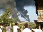 People look at thick columns of black smoke from Hkamti, Sagaing, Myanmar. (REUTERS) People look at thick columns of black smoke from Hkamti, Sagaing, Myanmar. (REUTERS)