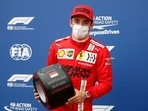Ferrari's Charles Leclerc reacts after getting pole position in qualifying.