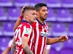Atletico Madrid's Luis Suarez (R) celebrates with teammate Kieran Trippier after scoring his side's second goal during the Spanish La Liga soccer match against Valladolid(AP)