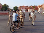 The penalty for not wearing a mask in public places has been increased to  <span class='webrupee'>₹</span>1000 from  <span class='webrupee'>₹</span>500. In picture - Police on duty during the Covid-19 curfew in Jaipur.