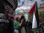 Protesters hold Palestinian flags in Paris. Protesters hold Palestinian flags in Paris.