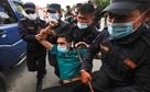 Nepal police personnel detain an activist during a protest outside the president building, after the president dissolved the parliament and fixed general elections in November, amid a worsening coronavirus disease (Covid-19) outbreak, in Kathmandu(REUTERS) Nepal police personnel detain an activist during a protest outside the president building, after the president dissolved the parliament and fixed general elections in November, amid a worsening coronavirus disease (Covid-19) outbreak, in Kathmandu(REUTERS)