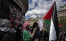 Protesters hold Palestinian flags in Paris. (AP Photo) Protesters hold Palestinian flags in Paris. (AP Photo)
