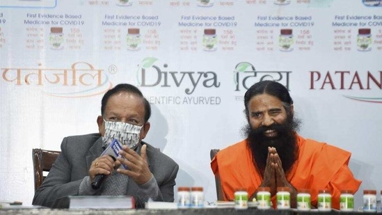 Union minister Harsh Vardhan with Ramdev at the launch of Patanjali’s Coronil medicine, in New Delhi on February 19. (File photo)
