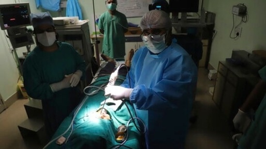 Doctor BP Tyagi performs extended functional endoscopic sinus surgery on a person suffering from mucormycosis at a hospital in Ghaziabad, outskirts of New Delhi, India, Sunday, May 23, 2021. (AP) Doctor BP Tyagi performs extended functional endoscopic sinus surgery on a person suffering from mucormycosis at a hospital in Ghaziabad, outskirts of New Delhi, India, Sunday, May 23, 2021. (AP)