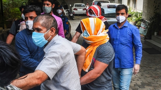 Olympics medal-winning wrestler Sushil Kumar and his associate Ajay Kumar, arrested in connection with the Chhatrasal Stadium brawl that led to the death of a wrestler, being escorted by the police at Saket Police Station, in New Delhi.(PTI)