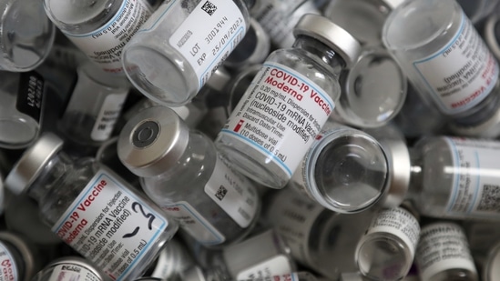 Empty vials of the Moderna COVID-19 vaccine lie in a box. (AP Photo)