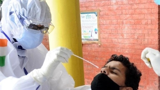 Health workers performing a Covid-19 test on a man (File Photo) Health workers performing a Covid-19 test on a man (File Photo)