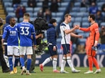 Tottenham Hotspur's Harry Kane shakes hands with Hugo Lloris after the match