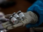 A health worker displays empty vials of COVAXIN at a vaccination center in Jammu, India, Monday, May 24, 2021. A health worker displays empty vials of COVAXIN at a vaccination center in Jammu, India, Monday, May 24, 2021.