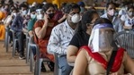 People wait to pay before receiving a dose of Covishield at a Covid-19 vaccination center set up at the BLK Super Speciality Hospital in New Delhi, India.(Bloomberg)