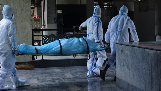 The body of a Covid-19 victim being brought in at Jawahar Baug Crematorium in Thane on May 22. India is only the third country after the United States and Brazil, respectively, to record more than 300,000 fatalities due to the viral disease. (Praful Gangurde / HT Photo) The body of a Covid-19 victim being brought in at Jawahar Baug Crematorium in Thane on May 22. India is only the third country after the United States and Brazil, respectively, to record more than 300,000 fatalities due to the viral disease. (Praful Gangurde / HT Photo)