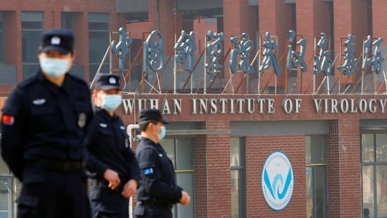 Security personnel keep watch outside Wuhan Institute of Virology during the visit by the WHO team tasked with investigating the origins of Covid-19, in&nbsp;Wuhan.(Reuters File Photo)
