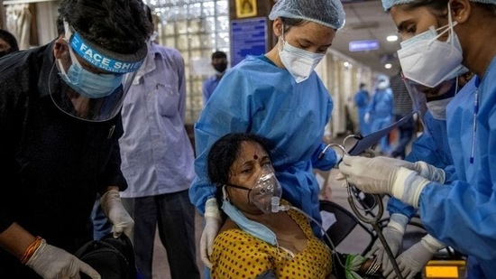 Covid-19 patients had to rely on each other to be able to do regular things as the staff at Covid Care Centres was overworked and overburdened. (Reuters Photo)