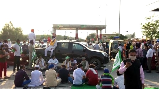 Farmers blocked the highway at Haryana-Punjab border at Shambhu toll plaza near Ambala on May 16 after police baton-charged farmers protesting against CM Manohar Lal Khattar in Hisar. (ANI Photo)