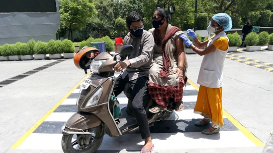 A medic inoculates the dose of the Covid-19 vaccine to a beneficiary during drive-in vaccination at Gautam Buddh Nagar in Noida. A medic inoculates the dose of the Covid-19 vaccine to a beneficiary during drive-in vaccination at Gautam Buddh Nagar in Noida.