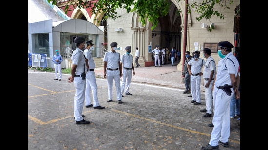 Police personnel guard at the Calcutta High Court during a hearing on the Narada scam case in Kolkata. (PTI) Police personnel guard at the Calcutta High Court during a hearing on the Narada scam case in Kolkata. (PTI)