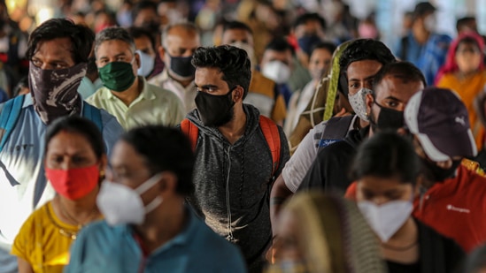 Passengers wait at a temperature checkpoint after arriving at Pune railway station during lockdown restrictions imposed by the Maharashtra government. (Bloomberg) Passengers wait at a temperature checkpoint after arriving at Pune railway station during lockdown restrictions imposed by the Maharashtra government. (Bloomberg)