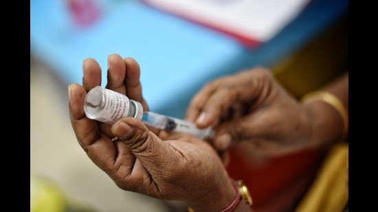 New Delhi, India - April 04, 2021: A health worker preparing a dose from a vial of Covaxin, a Covid-19 vaccine at a dispensary in Daryaganj, New Delhi, India, on Sunday, April 04, 2021. (Photo by Sanchit Khanna / Hindustan Times) New Delhi, India - April 04, 2021: A health worker preparing a dose from a vial of Covaxin, a Covid-19 vaccine at a dispensary in Daryaganj, New Delhi, India, on Sunday, April 04, 2021. (Photo by Sanchit Khanna / Hindustan Times)