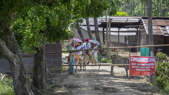 Health workers accompany villagers currently residing at a containment zone in Burha Mayong village, Assam on May 22. India’s Covid-19 tally has increased to 26,752,447 after 222,315 positive cases were detected in the past 24-hour period, HT reported. (Anupam Nath / AP) Health workers accompany villagers currently residing at a containment zone in Burha Mayong village, Assam on May 22. India’s Covid-19 tally has increased to 26,752,447 after 222,315 positive cases were detected in the past 24-hour period, HT reported. (Anupam Nath / AP)