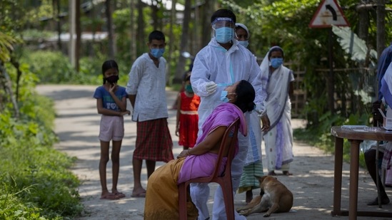 A health worker collects a nasal swab from a woman in Burha Mayong village, Assam on May 22. The government-run Indian Council of Medical Research (ICMR) said 1,928,127 tests were conducted in the last 24 hours, bringing total number of tests conducted thus far past the 330 million-mark to 330,536,064. (Anupam Nath / AP) A health worker collects a nasal swab from a woman in Burha Mayong village, Assam on May 22. The government-run Indian Council of Medical Research (ICMR) said 1,928,127 tests were conducted in the last 24 hours, bringing total number of tests conducted thus far past the 330 million-mark to 330,536,064. (Anupam Nath / AP)