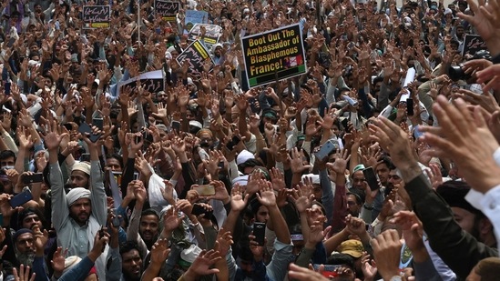 Supporters of Tehreek-e-Labbaik Pakistan (TLP) party shout slogans during a protest after their leader was detained following his calls for the expulsion of the French ambassador, in Lahore. (AFP)