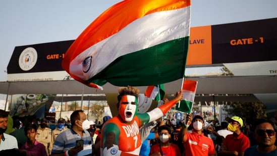 Cricket fans cheer for their teams(PTI) Cricket fans cheer for their teams(PTI)