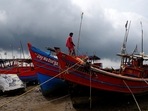 A fisherman ties his boat on a shore ahead of Cyclone Yaas in Digha in Purba Medinipur district in West Bengal.  
