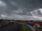 Dark clouds loom over fishing boats moored as Cyclone Yaas barrels towards India's eastern coast in the Bay of Bengal where is expected to make a landfall tomorrow, in Digha some 190 Km from Kolkata on May 25, 2021. 