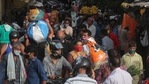 People, mostly wearing face masks as a precaution against the coronavirus, crowd a vegetable market as they shop for essentials in Mumbai, India, Tuesday, May 25, 2021(AP)