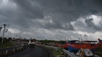 Dark clouds loom over fishing boats moored as Cyclone Yaas barrels towards India's eastern coast in the Bay of Bengal where is expected to make a landfall tomorrow, in Digha some 190 Km from Kolkata on May 25, 2021. (AFP) Dark clouds loom over fishing boats moored as Cyclone Yaas barrels towards India's eastern coast in the Bay of Bengal where is expected to make a landfall tomorrow, in Digha some 190 Km from Kolkata on May 25, 2021. (AFP)