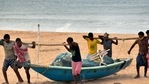 Fishermen carry a boat to a safe place ahead of Cyclone Yaas at Puri beach in Odisha.(PTI Photo) Fishermen carry a boat to a safe place ahead of Cyclone Yaas at Puri beach in Odisha.(PTI Photo)