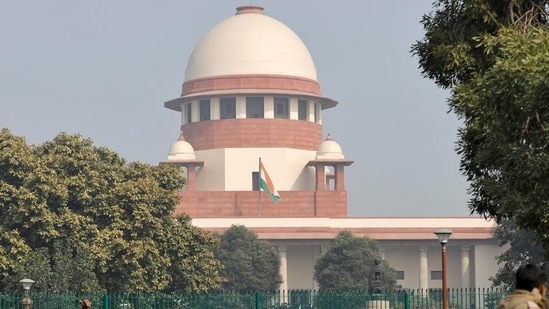 Television journalists are seen outside the premises of the Supreme Court in New Delhi, India, January 22, 2020. 