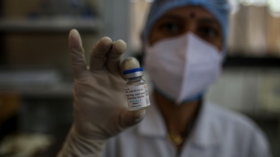 A nurse displays a vial of Bharat Biotech Ltd. Covaxin vaccine arranged at a Covid-19 vaccination center at a municipal hospital in Pune. (Bloomberg) A nurse displays a vial of Bharat Biotech Ltd. Covaxin vaccine arranged at a Covid-19 vaccination center at a municipal hospital in Pune. (Bloomberg)