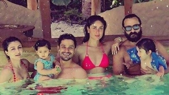 Kareena Kapoor poses with her husband Saif Ali Khan, and their family.