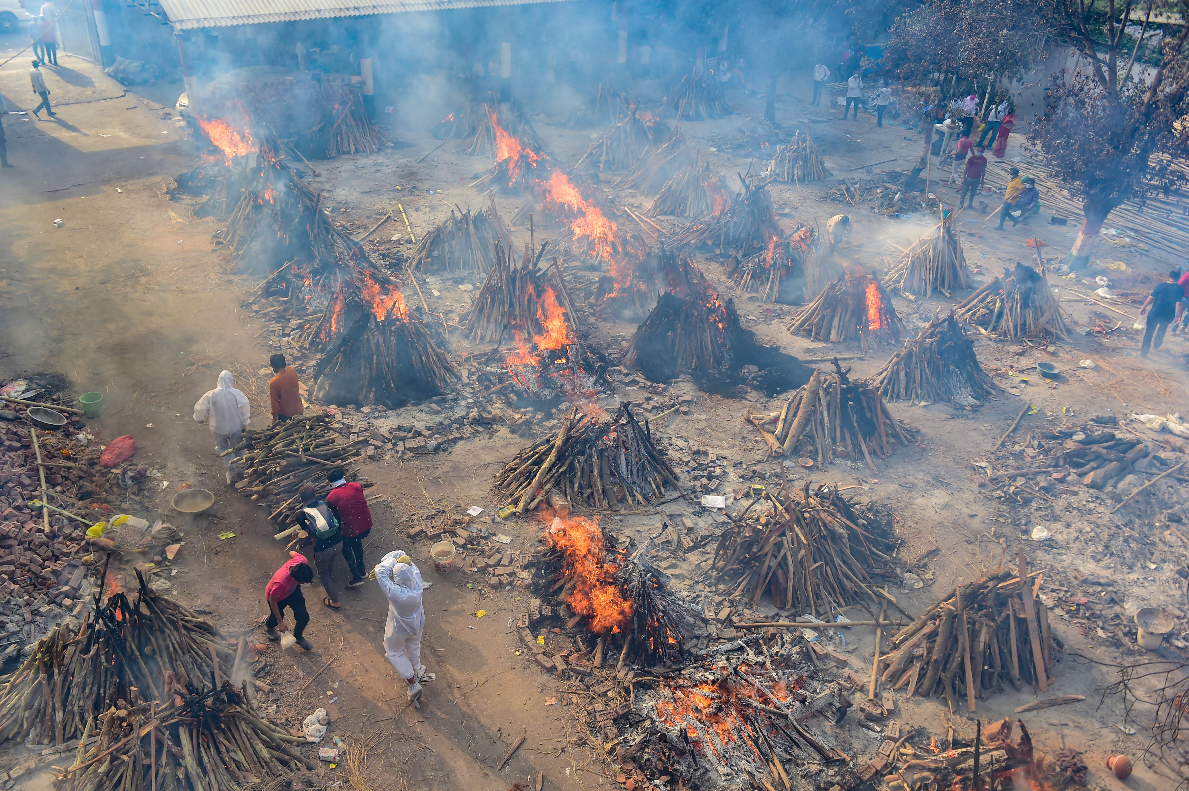 Mass cremation of people who died of Covid-19 coronavirus at a cremation ground at Ghazipur, in New Delhi, Friday, April 30, 2021. (PTI) Mass cremation of people who died of Covid-19 coronavirus at a cremation ground at Ghazipur, in New Delhi, Friday, April 30, 2021. (PTI)