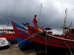 A fisherman ties his boat on a shore ahead of Cyclone Yaas in Digha in Purba Medinipur district in the eastern state of West Bengal