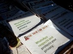 A WhatsApp advertisement is seen on the front pages of newspapers at a stall in Mumbai, India. 