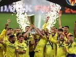 Villarreal celebrates with the Europa League trophy after winning the final.
