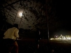 A man and her friend watch as the lunar eclipse progresses at Santa Monica Beach in Santa Monica, California, on Wednesday. A man and her friend watch as the lunar eclipse progresses at Santa Monica Beach in Santa Monica, California, on Wednesday.