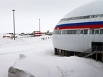 Russian forces are stationed in a clover-shaped complex painted in the colours of the Russian flag: white, blue and red.