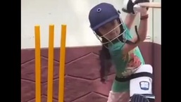 The image shows Mehek from Kerala playing cricket.