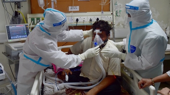 Doctors attend to a Covid-19 patient at the Government Institute of Medical Sciences, in Greater Noida.(PTI)