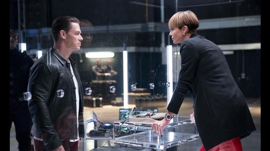 John Cena and Charlize Theron in a scene from F9. (AP)