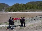 Relatives of Pramila Devi carrying her body to be cremated on the banks of the river Ganga, in Pauri Garhwal on May 24. The 36-year-old mother-of-three died the previous night in a village in the Uttarakhand, a day after testing positive for Covid-19.